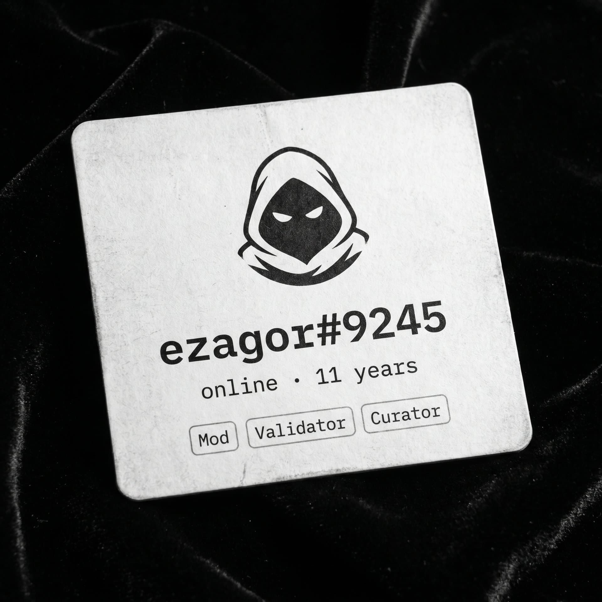 Discord-style profile card on black velvet showing 'ezagor#9245' with hooded avatar.